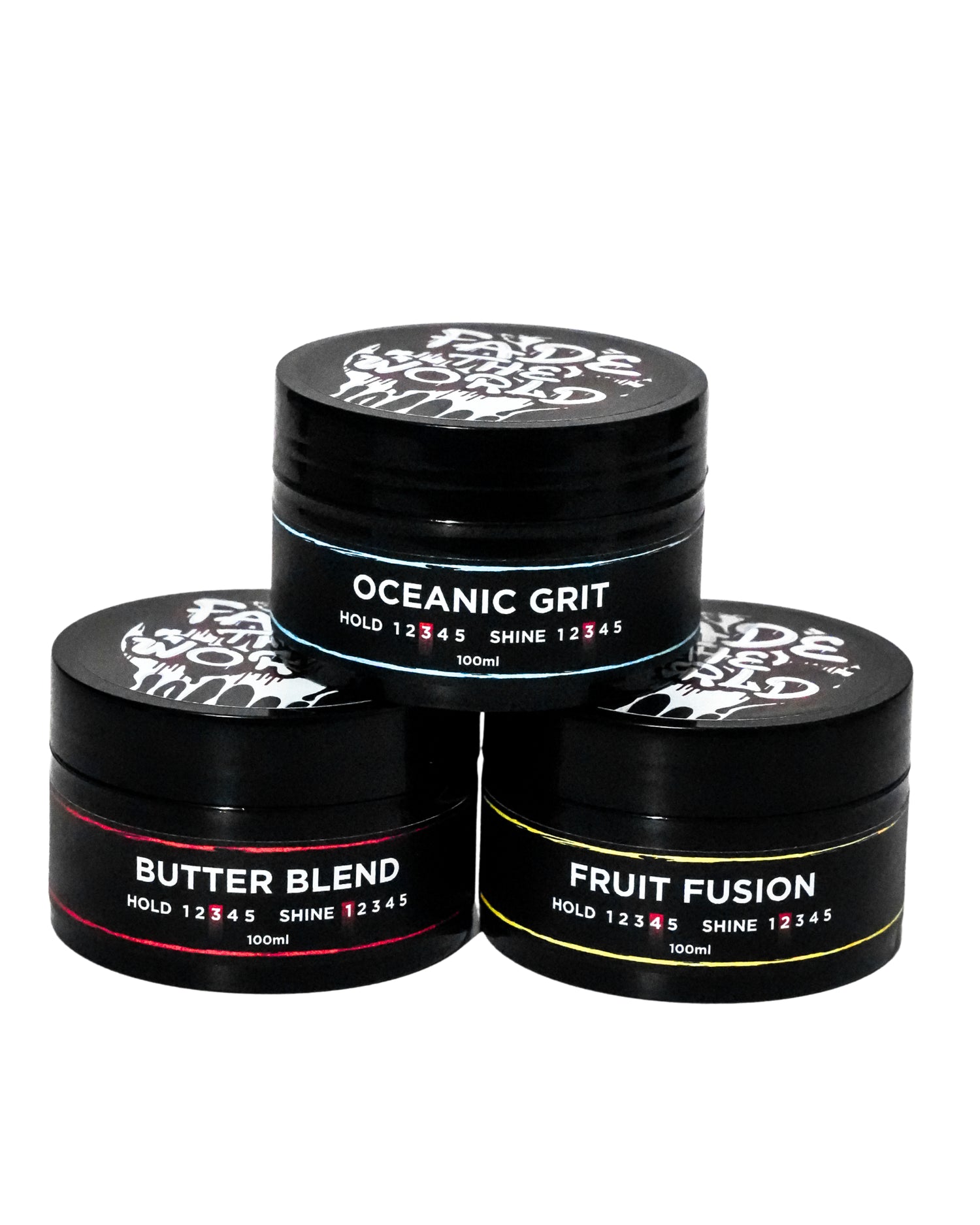 Three black hair product jars labeled 'Oceanic Grit', 'Butter Blend', and 'Fruit Fusion' on a white background.